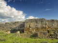 Dramatic blue sky with white clouds over the ruins of the ancient greek colony of Histria, on the shores of Black Sea. Histria is Royalty Free Stock Photo