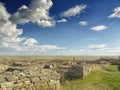 Dramatic blue sky with white clouds over the ruins of the ancient greek colony of Histria, on the shores of Black Sea. Histria is Royalty Free Stock Photo