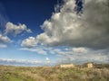 Dramatic blue sky with white clouds over the ruins of the ancient greek colony of Histria, on the shores of Black Sea. Histria is Royalty Free Stock Photo