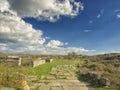 Dramatic blue sky with white clouds over the ruins of the ancient greek colony of Histria, on the shores of Black Sea. Histria is Royalty Free Stock Photo