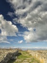 Dramatic blue sky with white clouds over the ruins of the ancient greek colony of Histria, on the shores of Black Sea. Histria is Royalty Free Stock Photo