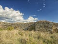 Dramatic blue sky with white clouds over the ruins of the ancient greek colony of Histria, on the shores of Black Sea. Histria is Royalty Free Stock Photo