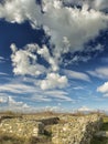 Dramatic blue sky with white clouds over the ruins of the ancient greek colony of Histria, on the shores of Black Sea. Histria is Royalty Free Stock Photo