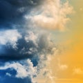 Dramatic blue thunderclouds and stunning yellow-golden fluffy clouds