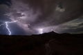 Dramatic bolts of lightning at night above Gooseberry Mesa in Southern Utah Royalty Free Stock Photo