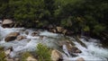 Dramatic boulders and ragging creek