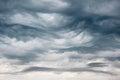 Dramatic breathtaking heavy rain Undulatus asperatus clouds with dark blue textures and undulating ripples and waves