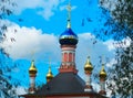 Dramatic church with golden domes background