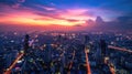 Dramatic cityscape of city at sunset with night lights