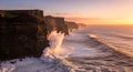 A dramatic cliffside meets the ocean at sunset with waves crashing powerfully Royalty Free Stock Photo