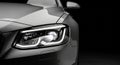 Close Up of Modern Car Headlight with LED Daytime Running Lights in Black and White automotive technology Royalty Free Stock Photo