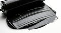 Glossy black brayer spreading thick dark ink Royalty Free Stock Photo