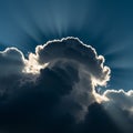 Dramatic cloud formation with sunlight streaming from behind, creating a striking Royalty Free Stock Photo