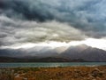 Dramatic clouds above lake near Mendoza in Argentinian Andes Royalty Free Stock Photo