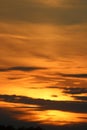 Dramatic clouds and colors, orange, yellow at sunset Royalty Free Stock Photo