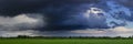 Dramatic clouds, field and sky with dark clouds Royalty Free Stock Photo