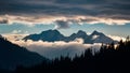 Dramatic clouds frame mountain peaks and towering trees in silhouette Royalty Free Stock Photo