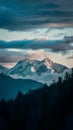 Dramatic clouds frame mountain peaks and towering trees in silhouette Royalty Free Stock Photo