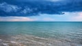 Dramatic clouds over the blue sea in front of the storm Royalty Free Stock Photo