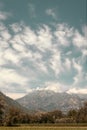 Dramatic clouds over the mountains in the Italian countryside with a teal sky Royalty Free Stock Photo