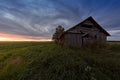 Dramatic Clouds Over An Old Barn House