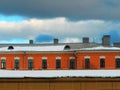 Dramatic clouds over vintage brick building