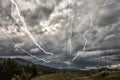 Dramatic clouds and Power Distribution Station with Lightning Striking to the Electricity Towers Royalty Free Stock Photo