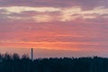 dramatic clouds on red sky over city roof tops Royalty Free Stock Photo