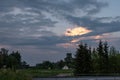 dramatic clouds on red sky over city roof tops Royalty Free Stock Photo