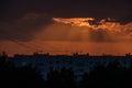 dramatic clouds on red sky over city roof tops Royalty Free Stock Photo