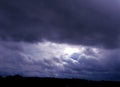 Dramatic clouds roll in beneath looming dark clouds above Royalty Free Stock Photo