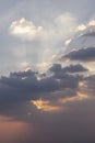 Dramatic clouds and shining form an interesting light pattern against the sky background Royalty Free Stock Photo