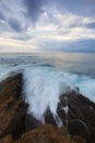 Dramatic clouds at sunrise on the coast of Castro Urdiales Royalty Free Stock Photo