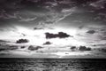 Dramatic clouds at sunset from the sea in black and white tone Royalty Free Stock Photo