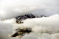 Dramatic clouds surrounding peak Ziel near Merano, Italy. Royalty Free Stock Photo