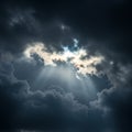 Dramatic cloudscape featuring dark, dense clouds with a bright opening in the center Royalty Free Stock Photo