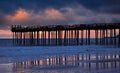 Dramatic cloudscape over beach in Port Hueneme, California at sunset. Royalty Free Stock Photo