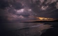 Dramatic overcasting dark clouds over beach on Cape Cod in summer