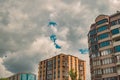 Dramatic cloudy gray city living apartments buildings perspective urban view with moody sky background, copy space