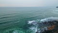 Dramatic cloudy marine panorama aerial view. Foamy ocean waves covering beach Royalty Free Stock Photo