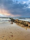 Dramatic cloudy sky and Baltic sea beach at sunset Royalty Free Stock Photo