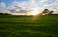 Dramatic sky at dusk over countryside fields in summer Royalty Free Stock Photo