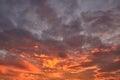 Dramatic cloudy sky in the rays of setting sun Royalty Free Stock Photo