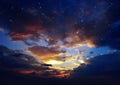 Dramatic cloudy starry sky star fall and orange sunset at summer night cloudy seascape nature background weather forecast Royalty Free Stock Photo