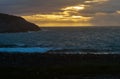 Dramatic cloudy sunset over the turbulent northern sea Royalty Free Stock Photo