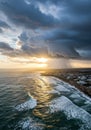 Dramatic Coastal Sunset with Storm Clouds and Rain Royalty Free Stock Photo
