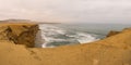 Dramatic coastline with intense colors in the desert of Paracas National Reserve Royalty Free Stock Photo