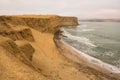 Dramatic coastline with intense colors in the desert of Paracas National Reserve Royalty Free Stock Photo
