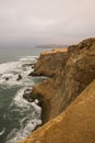 Dramatic coastline with intense colors in the desert of Paracas National Reserve Royalty Free Stock Photo