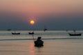 Dramatic of colorful sea and sunset sky with boats Royalty Free Stock Photo